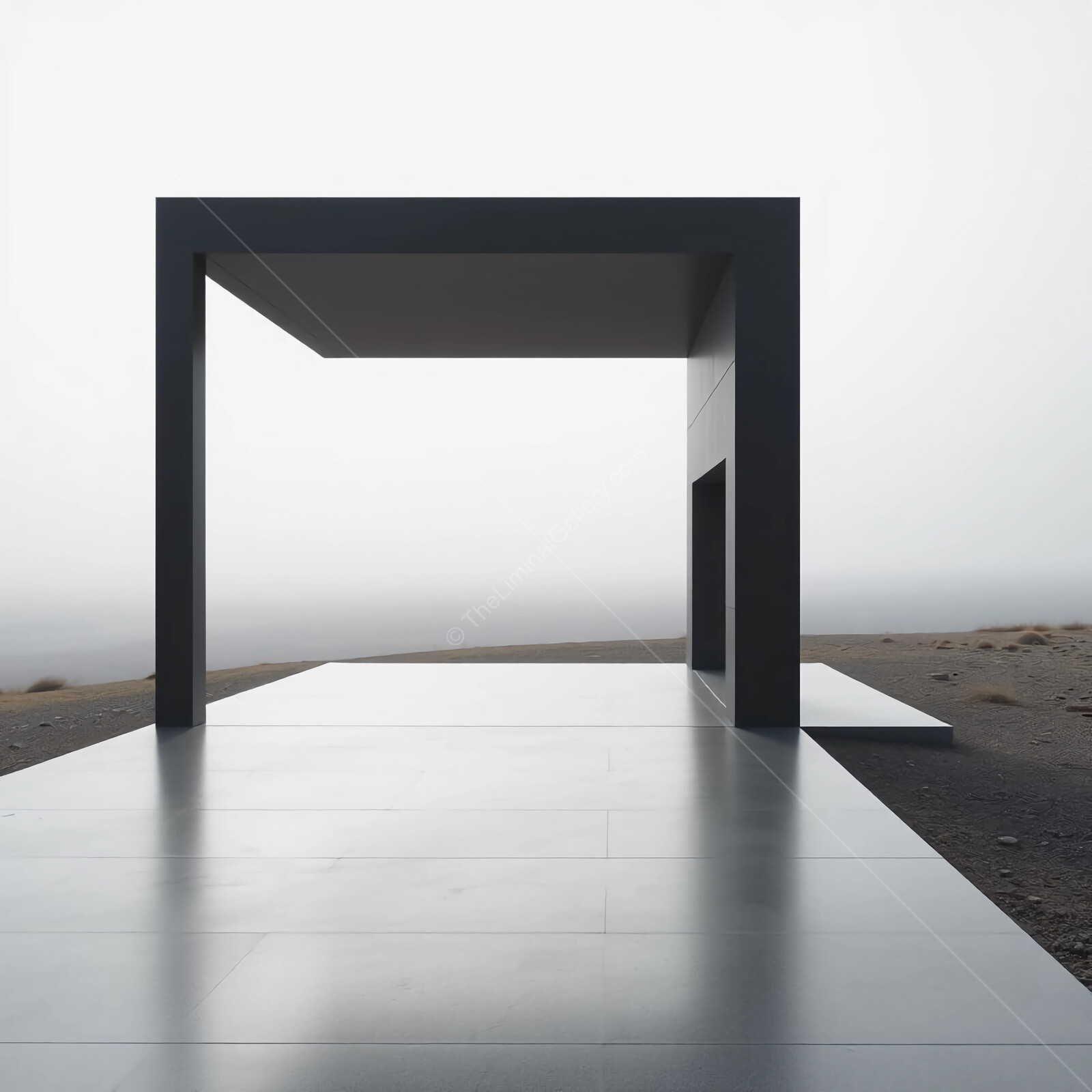 Minimalist architectural structure stands in solitude against a foggy landscape at dawn