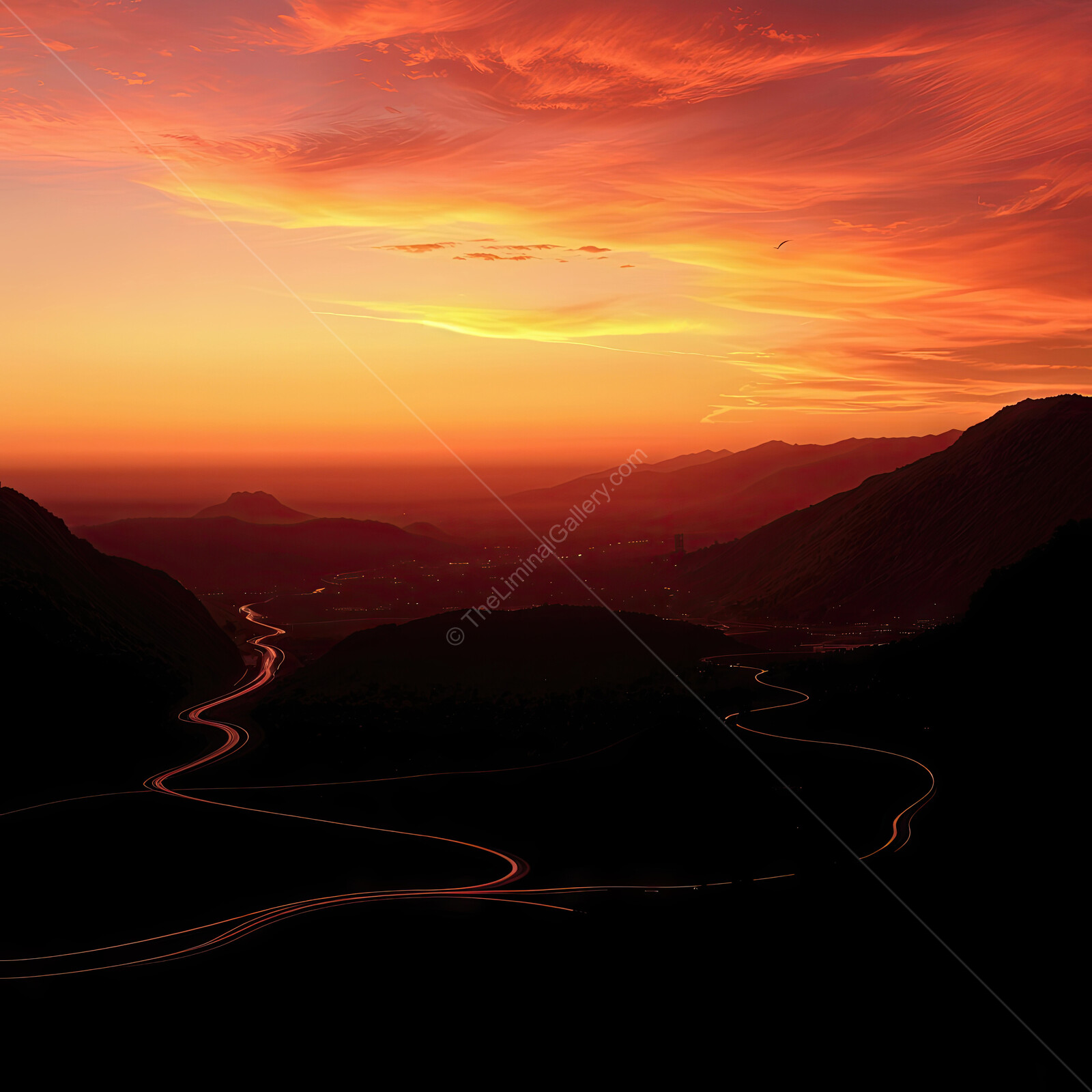 Sky ablaze with vibrant colors at sunset over winding mountain roads